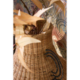 Rotan vaas met takken erin