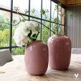 Pastel roze vaas met takken
