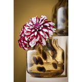 Vaas met zwarte stippen met bloem