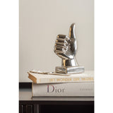 Duim beeld zilver op boeken
