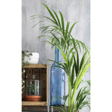 Rojan fles vaas mica decorations op tafel